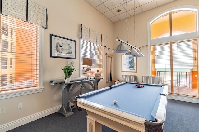 game room with dark carpet, a paneled ceiling, and pool table