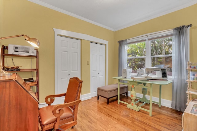 office space with ornamental molding and light hardwood / wood-style flooring