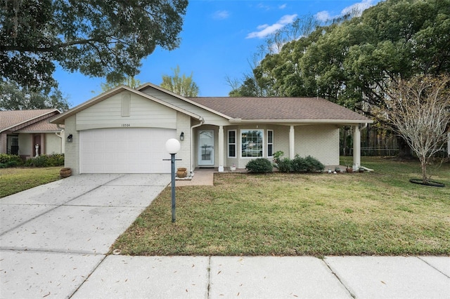 ranch-style house with a garage and a front yard