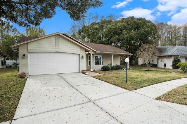 ranch-style house featuring a garage and a front yard