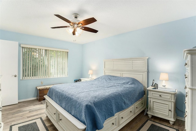 bedroom featuring hardwood / wood-style flooring and ceiling fan