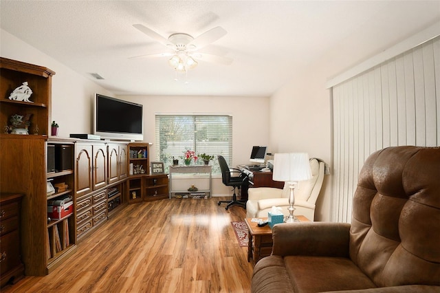 sitting room with ceiling fan and light hardwood / wood-style floors