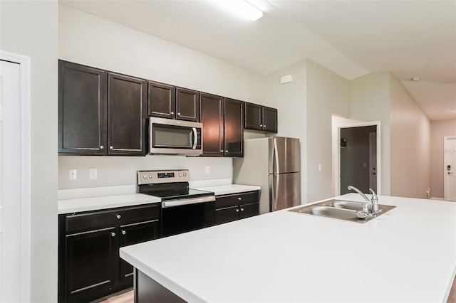 kitchen with sink, a center island with sink, and appliances with stainless steel finishes