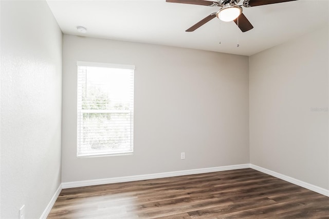 unfurnished room featuring ceiling fan and dark hardwood / wood-style flooring