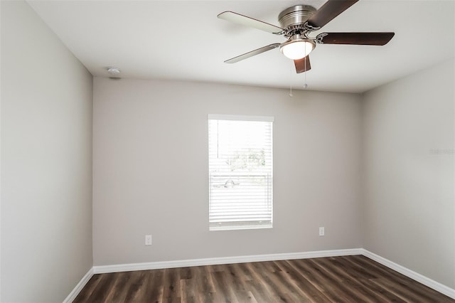 unfurnished room featuring dark wood-type flooring and ceiling fan