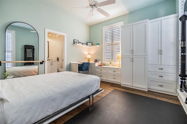 bedroom with dark hardwood / wood-style flooring, connected bathroom, and ceiling fan