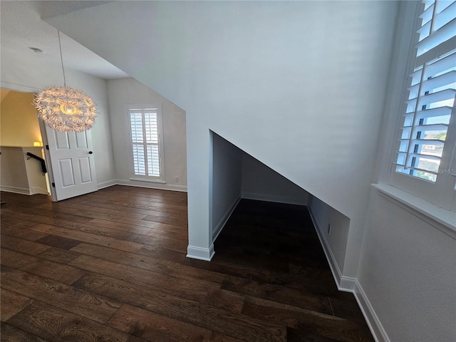 entryway featuring a chandelier and dark hardwood / wood-style flooring