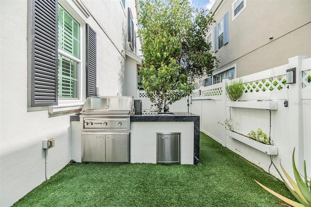 view of patio / terrace featuring exterior kitchen and area for grilling