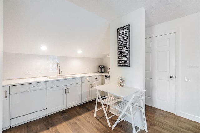 kitchen featuring sink, dark hardwood / wood-style floors, dishwasher, white cabinets, and backsplash