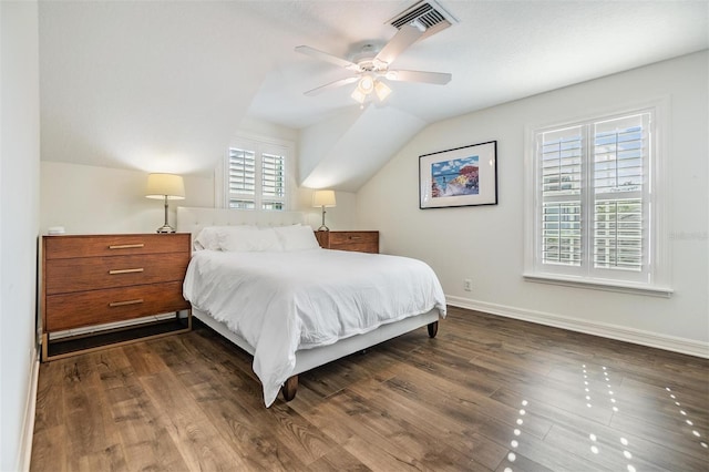 bedroom with vaulted ceiling, dark hardwood / wood-style floors, and ceiling fan