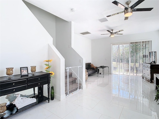 interior space featuring tile patterned floors and ceiling fan