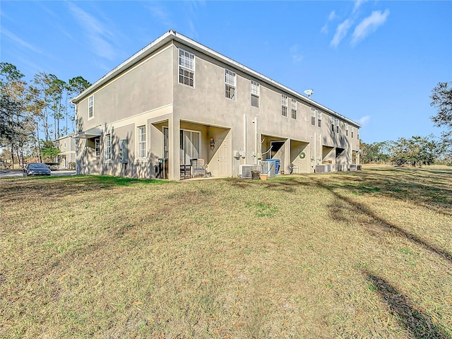 rear view of house with a yard