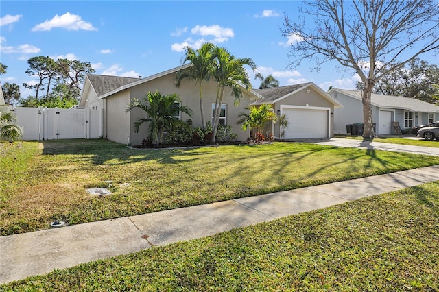 ranch-style home featuring a garage and a front lawn