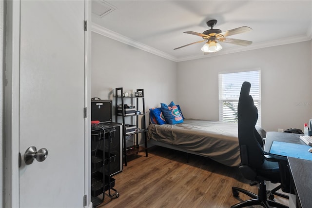 bedroom with dark hardwood / wood-style flooring, crown molding, and ceiling fan