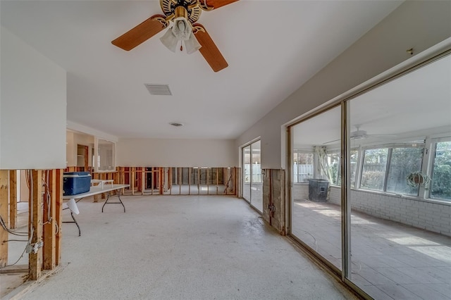 unfurnished sunroom with plenty of natural light and ceiling fan