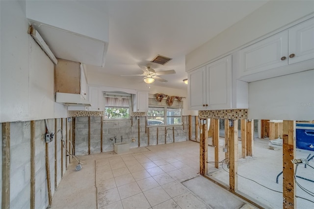 kitchen with white cabinetry, ceiling fan, and light tile patterned flooring