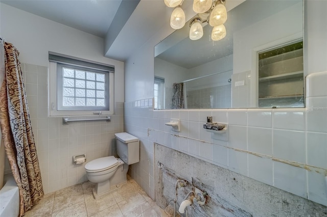 bathroom featuring tile walls, tile patterned flooring, toilet, and shower / bathtub combination with curtain