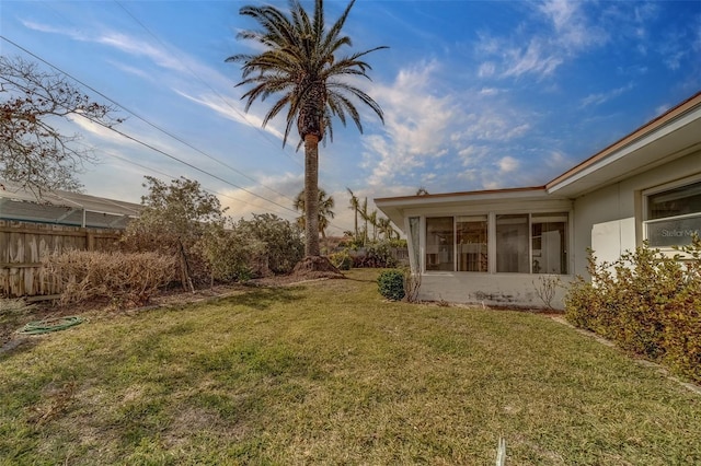 view of yard featuring a sunroom