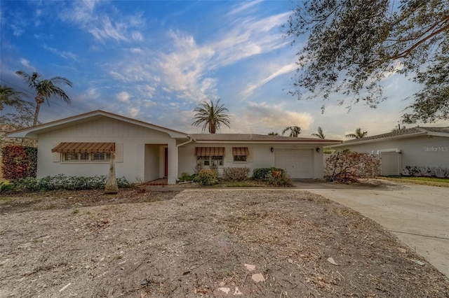 single story home with a garage