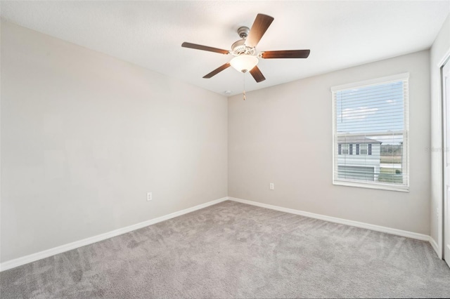 carpeted empty room with ceiling fan