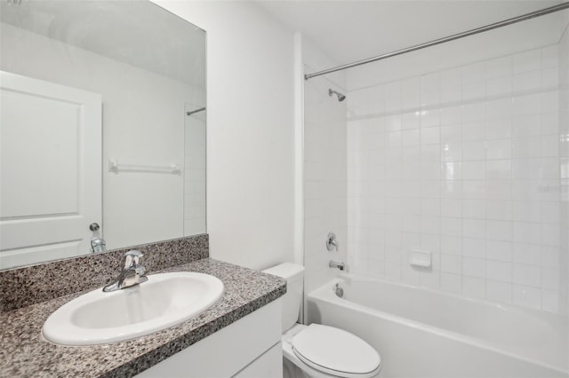 bathroom with shower / bath combination, vanity, and toilet