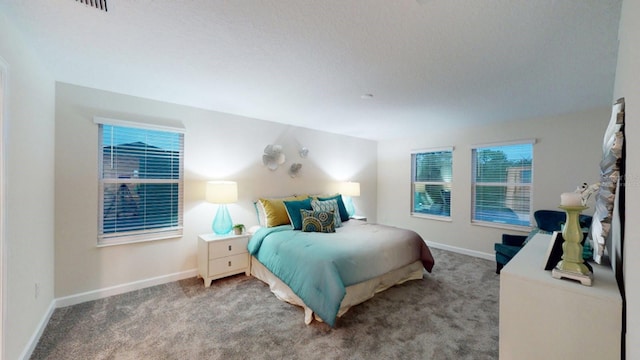 bedroom featuring light carpet