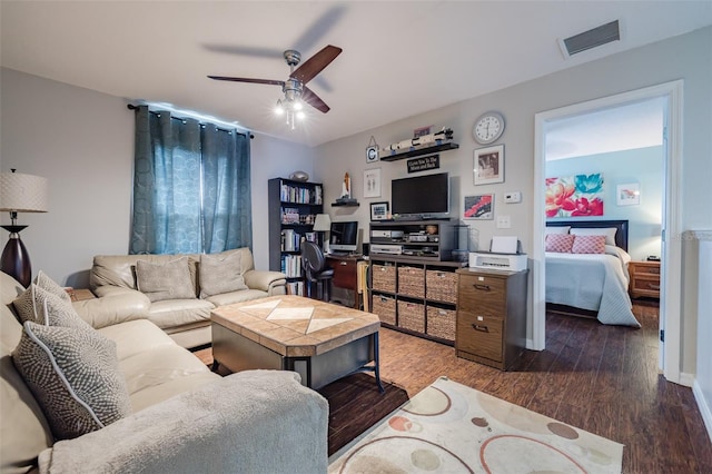 living room with dark hardwood / wood-style flooring and ceiling fan