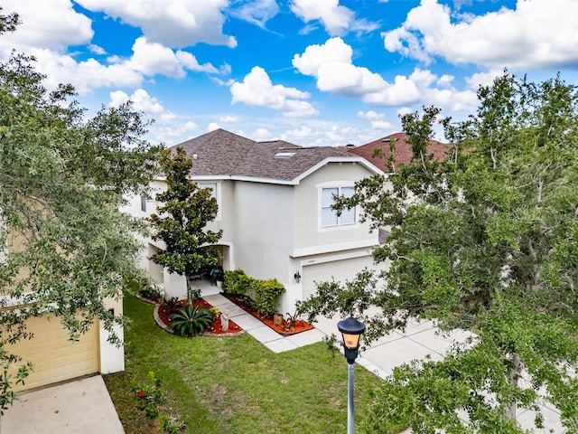 exterior space featuring a yard and a garage