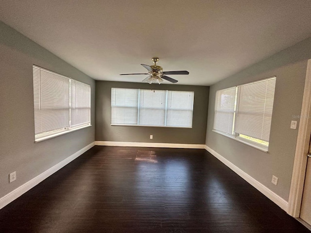 unfurnished room featuring dark hardwood / wood-style floors and ceiling fan