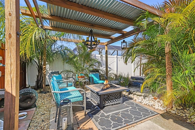 view of patio with a fire pit