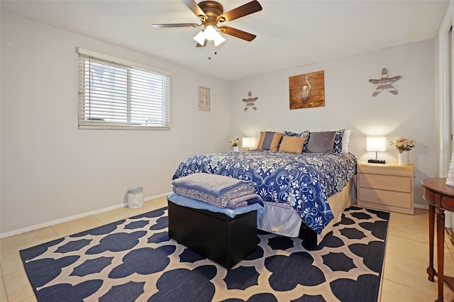 bedroom with ceiling fan and light tile patterned floors