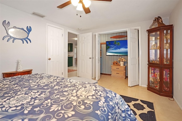 bedroom featuring light tile patterned flooring and ceiling fan