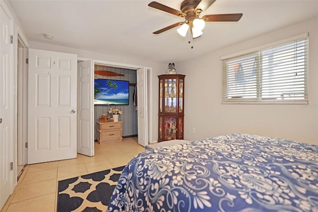 bedroom with light tile patterned flooring and ceiling fan