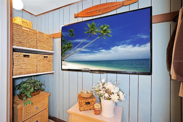 balcony with a water view and a beach view