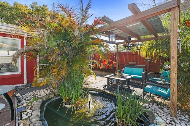 view of patio with an outdoor living space, a pergola, and a garden pond