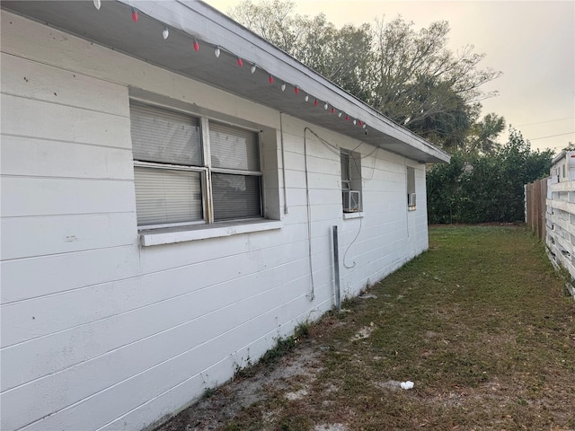 property exterior at dusk with a yard