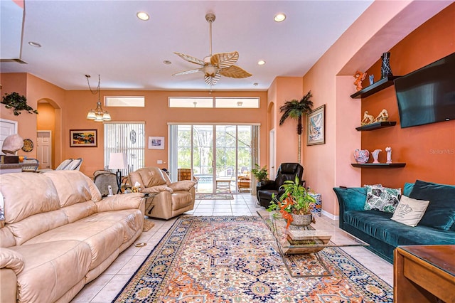 living room featuring light tile patterned flooring and ceiling fan