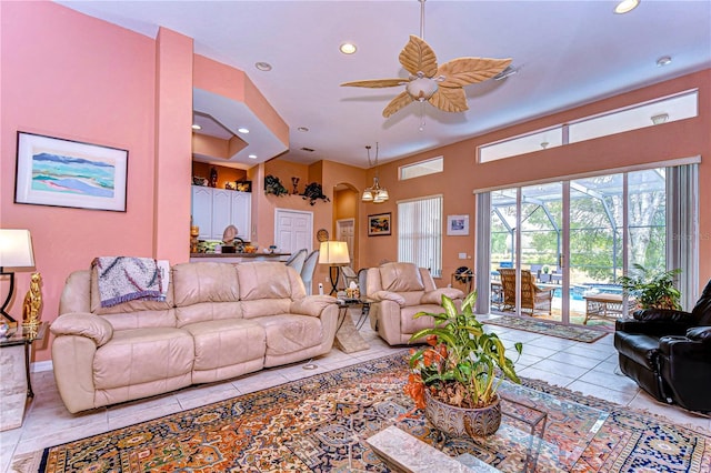 living room with ceiling fan and light tile patterned flooring