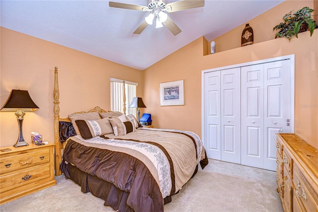 carpeted bedroom with lofted ceiling, a closet, and ceiling fan