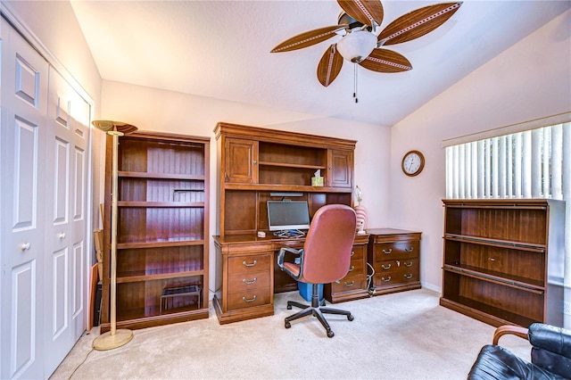 office area with lofted ceiling, light carpet, and ceiling fan