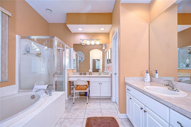 bathroom featuring vanity, tile patterned floors, and plus walk in shower