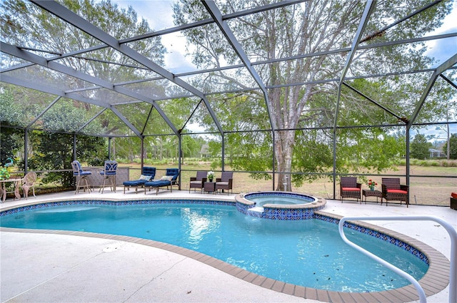 view of swimming pool featuring a lanai, a patio, and an in ground hot tub