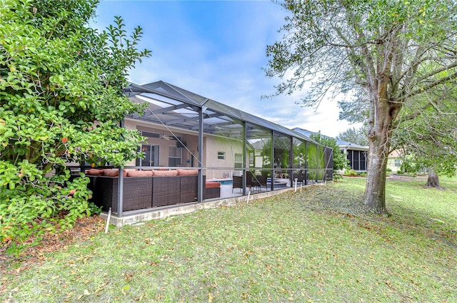 view of yard with a lanai, an outdoor hangout area, and a patio area