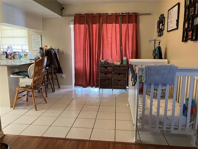 bedroom featuring light tile patterned floors