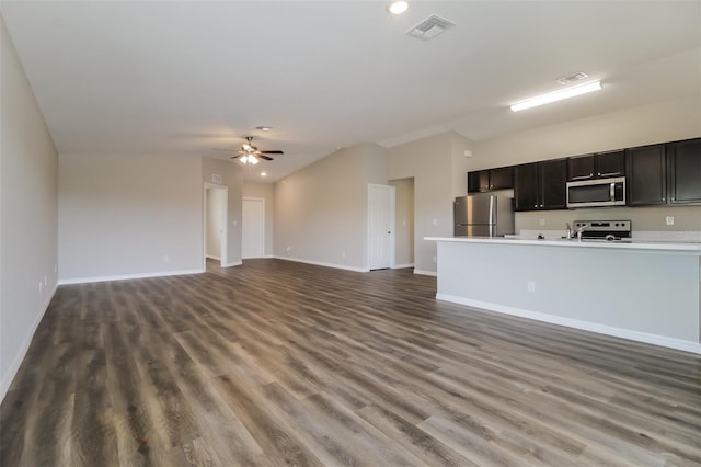 unfurnished living room featuring ceiling fan and dark hardwood / wood-style flooring