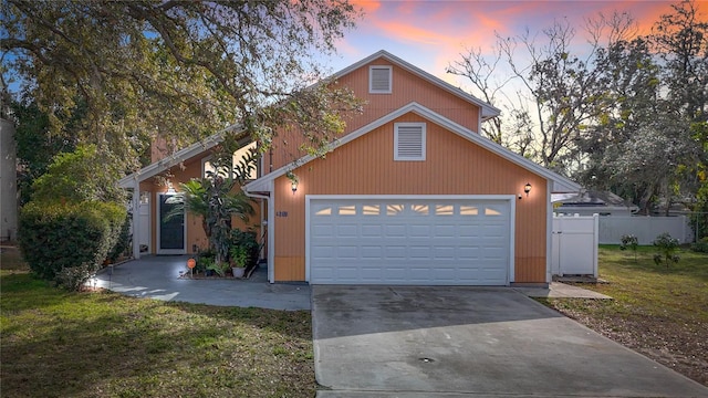 view of front facade featuring a garage and a lawn