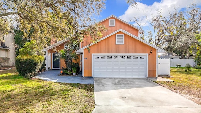 front of property with a garage and a front yard