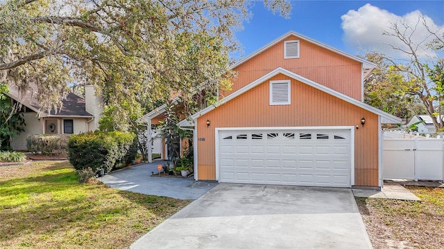 view of front of property with a garage and a front yard