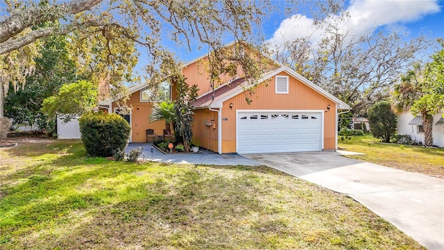 view of front of home with a garage and a front lawn