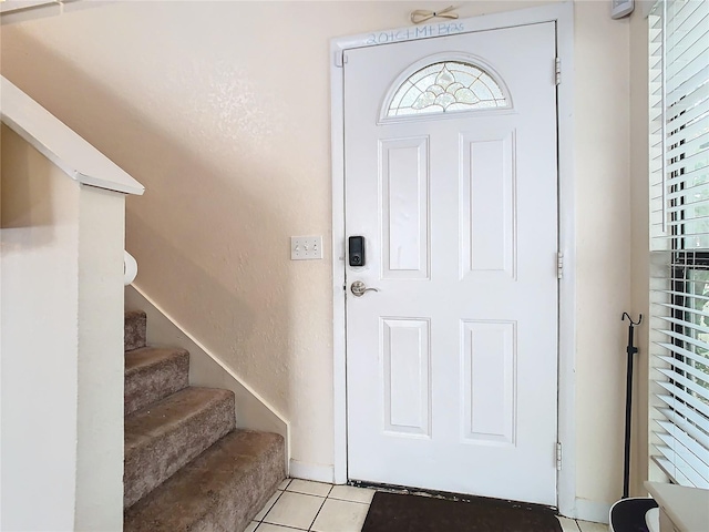 entryway featuring light tile patterned floors